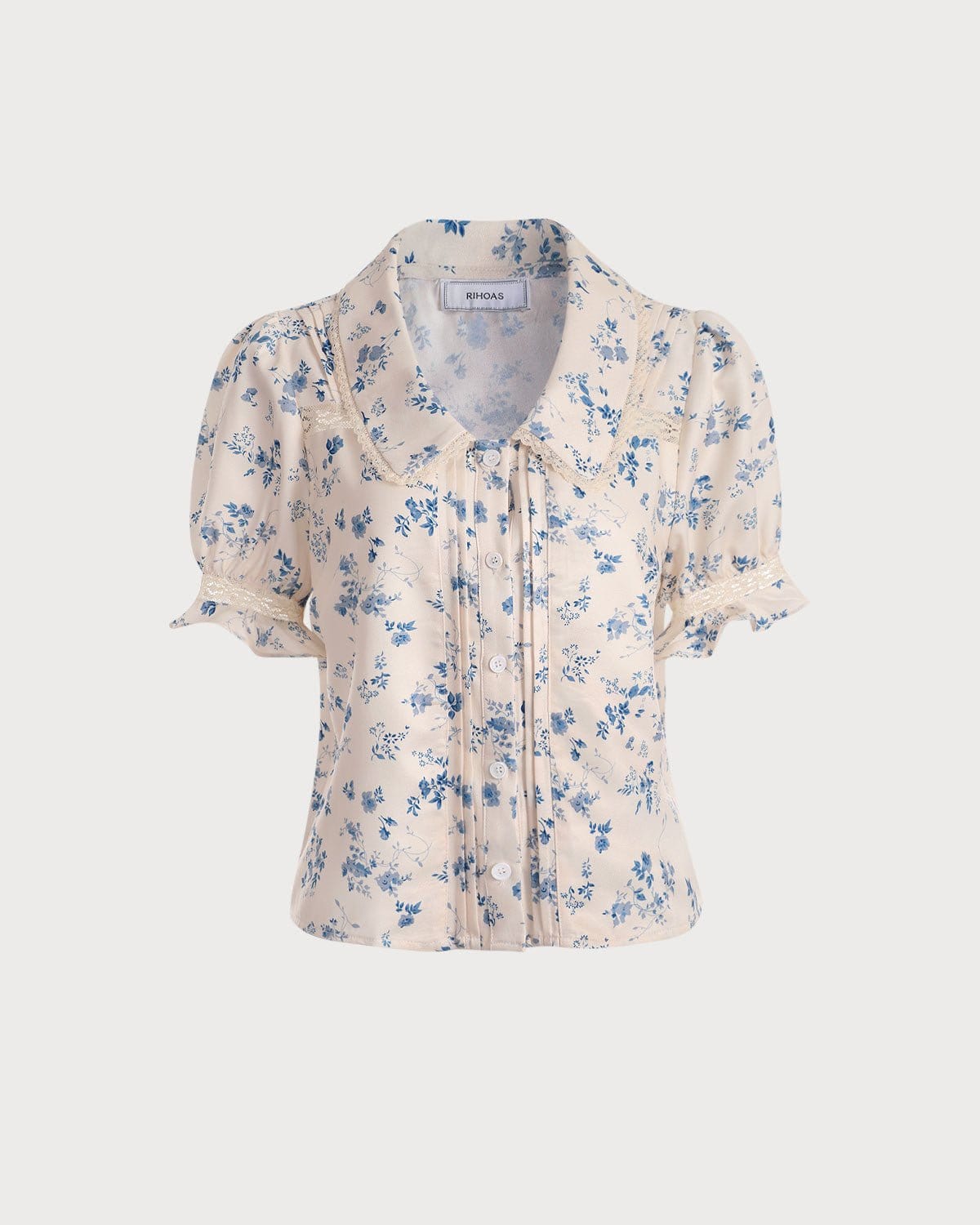 Camisa plisa floral con encaje